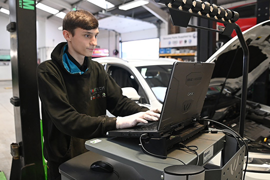 apprentice technician working on vehicle diagnostics