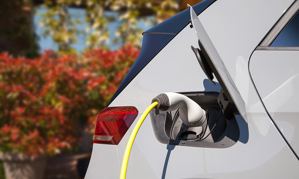 ev charge plug in grey car