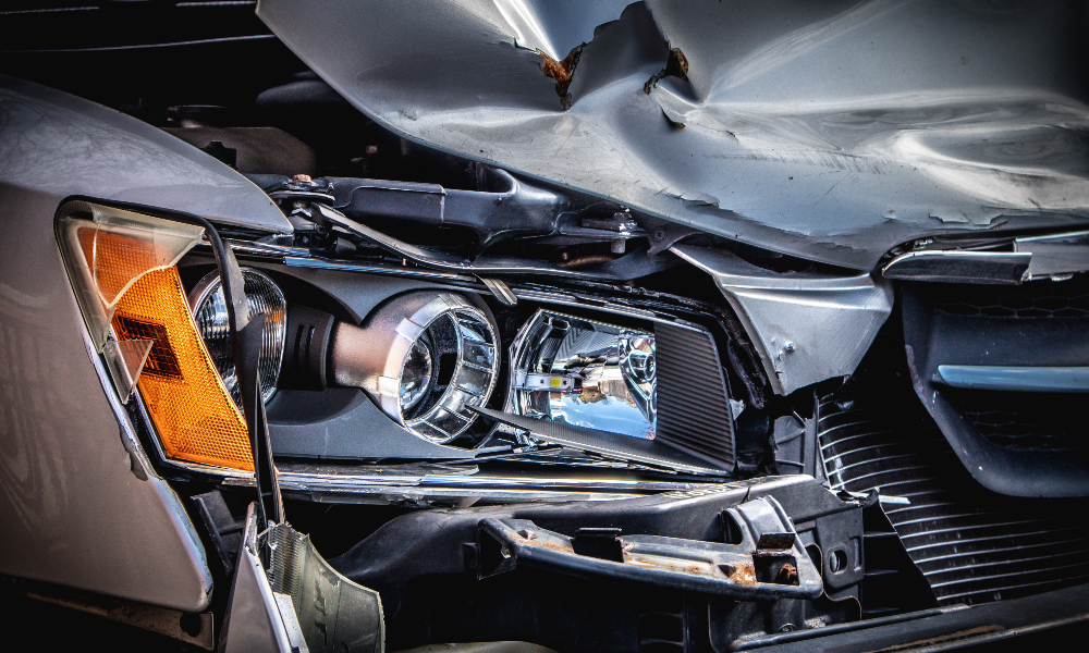 Damaged car bonnet and headlights