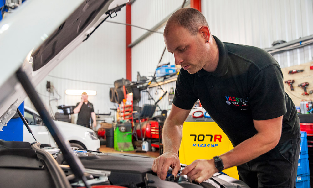 paul atkinson working on car in garage