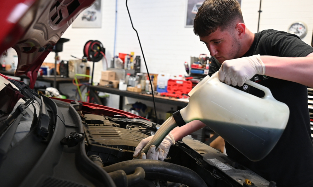 Oil replacement in vehicle performed by technician