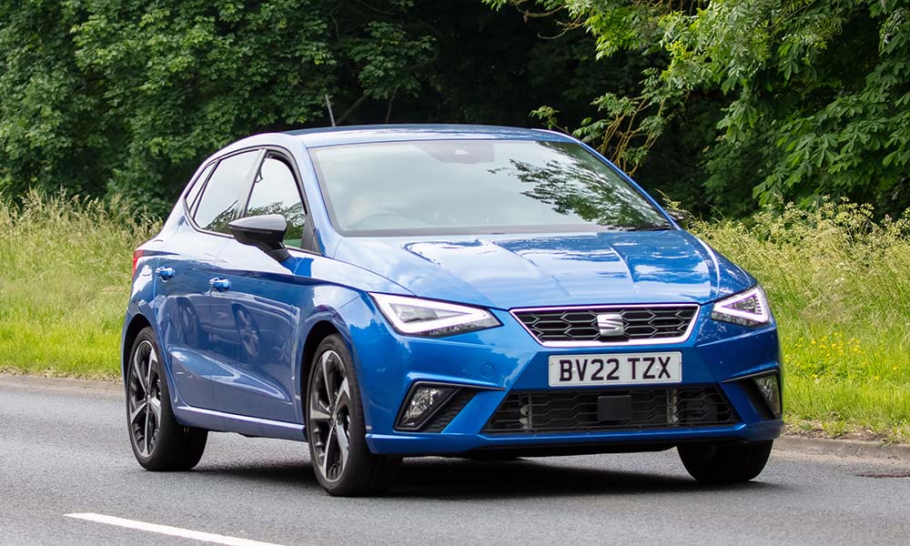 Blue SEAT Ibiza on road